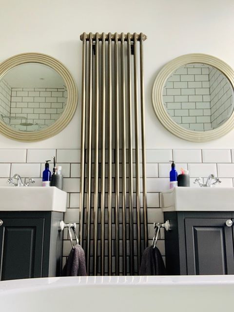 Columnrads's tweet photo. His and her's bathroom suit with a vertical raw metal radiator. Anyone else see an 🐘 or is just us? 

📷 @tresco_trio 

#hisandherbathroom #mycolumnrads #columnrads #cosyhome #homeheating #verticalrads #interiordesignuk https://t.co/QzKuhKyPaD