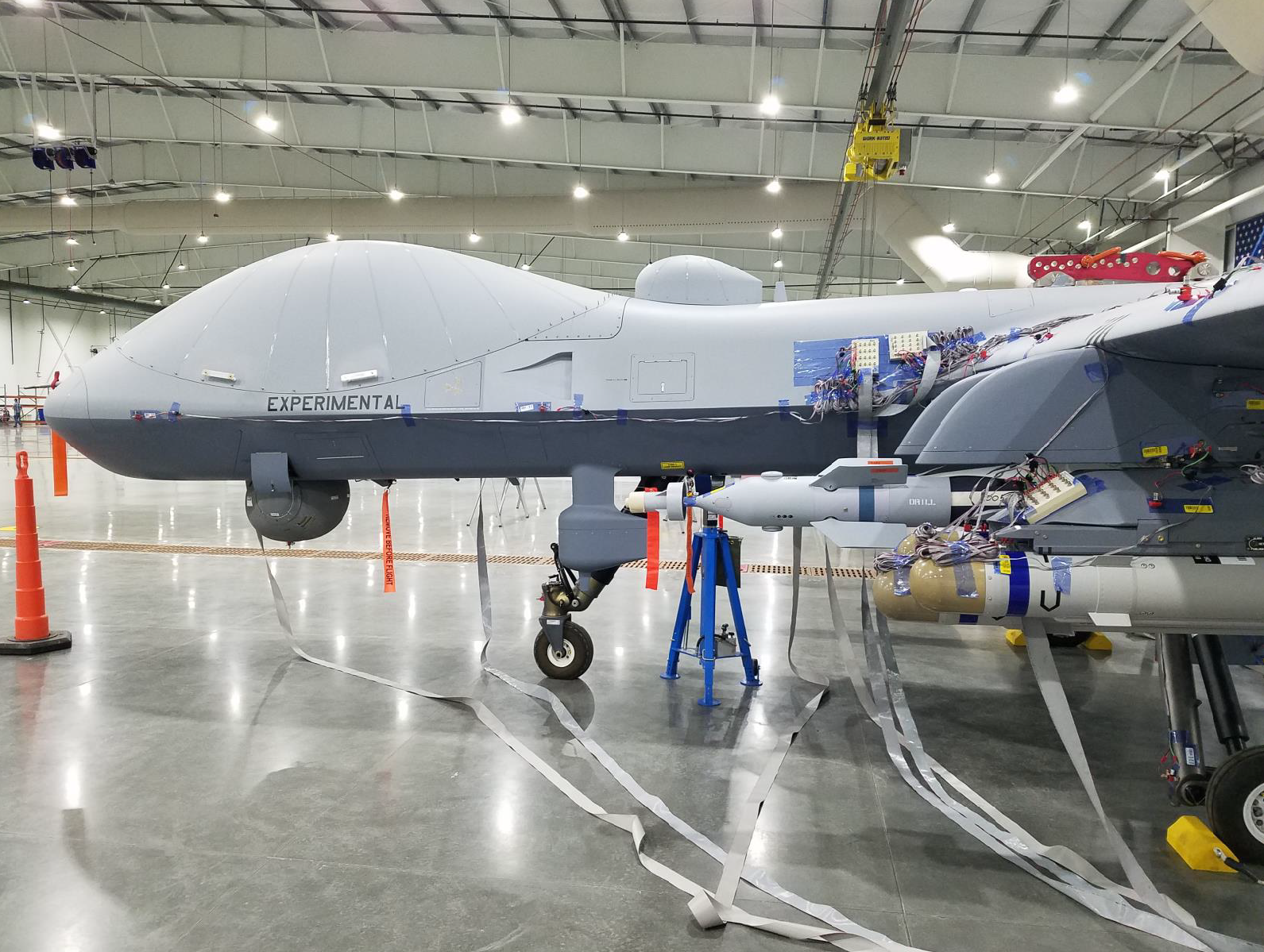 Image shows the front of the aircraft side on inside a hangar