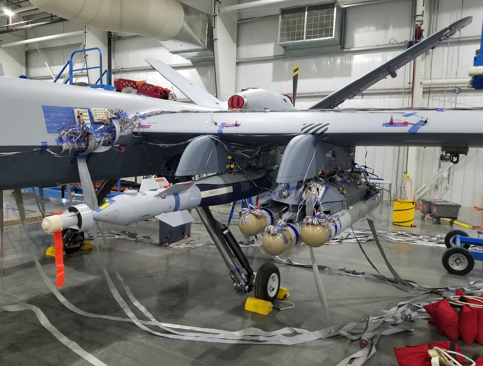 Image shows weapons mounted to the underside of the aircrafts wing