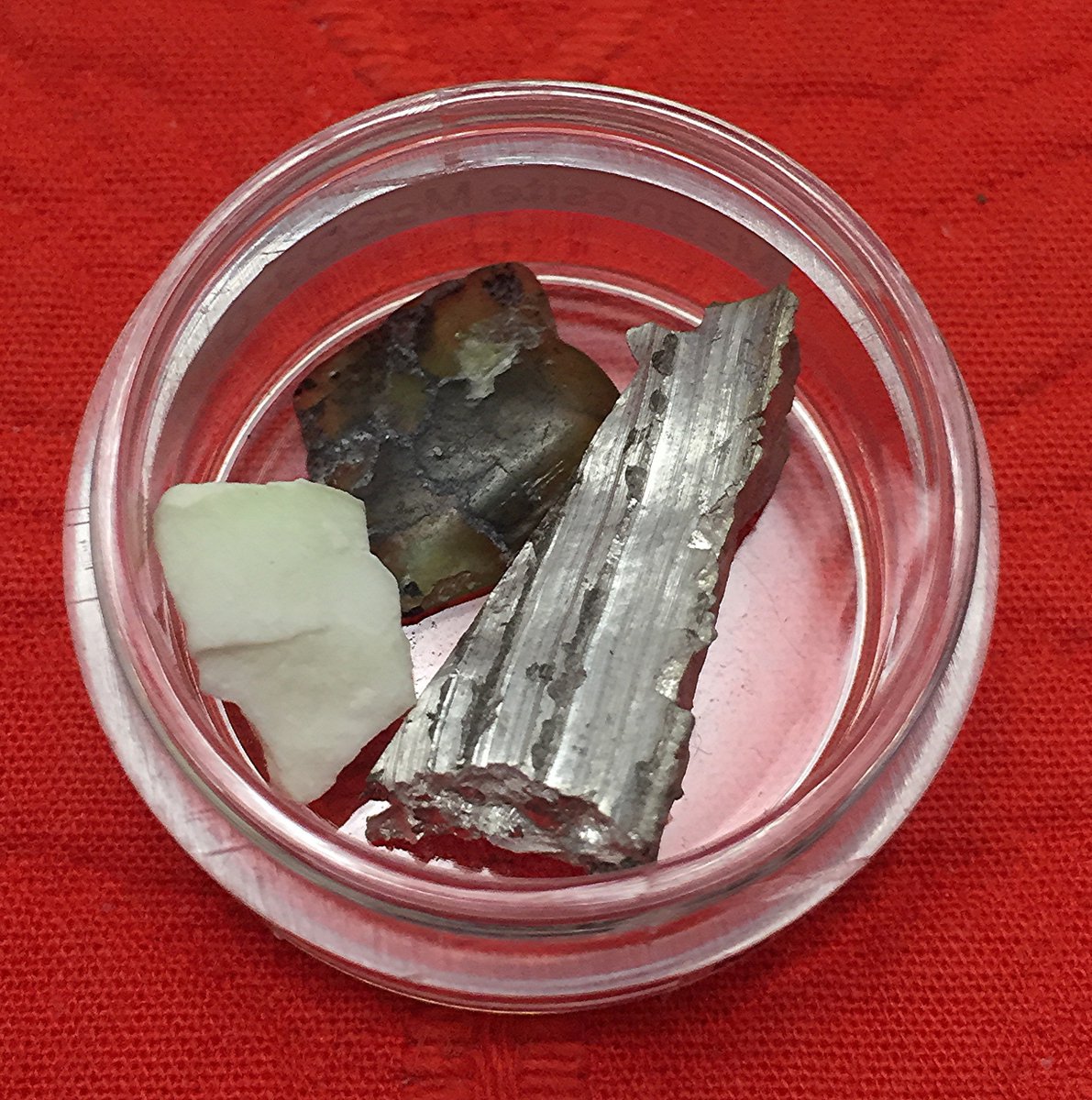 Magnesium  #elementphotos. Dark green crystal is olivine ((Mg,Fe)2SiO4), white crystal is magnesite (MgCO3).