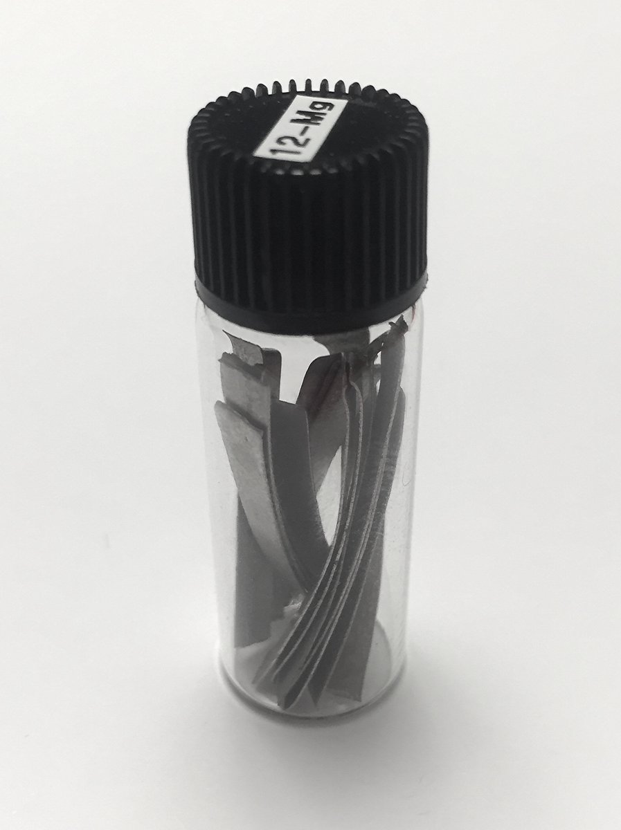 Magnesium  #elementphotos. Dark green crystal is olivine ((Mg,Fe)2SiO4), white crystal is magnesite (MgCO3).