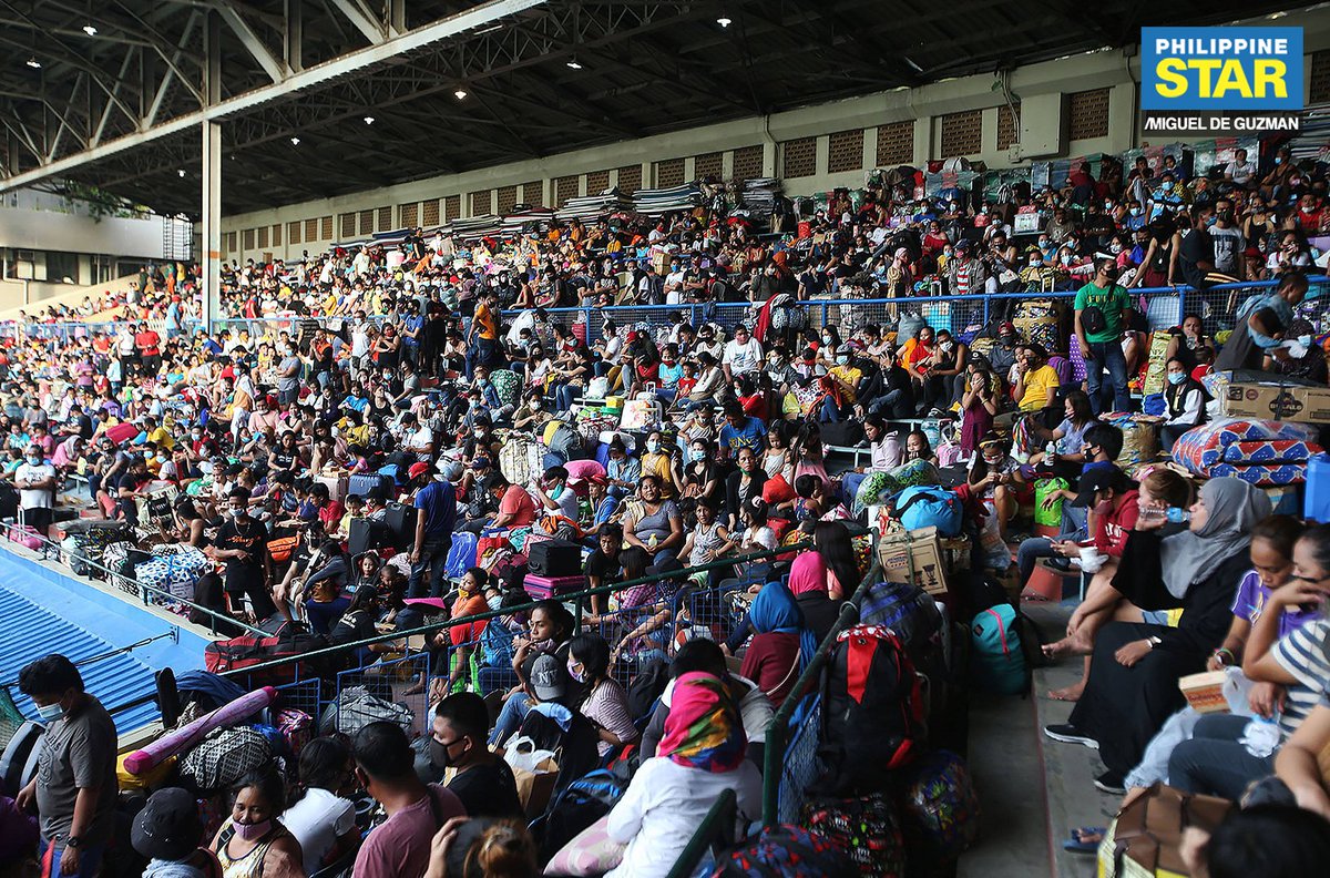 PhilippineStar's tweet photo. Locally stranded individuals (LSIs), who are beneficiaries of the second batch of the Hatid Tulong program, set up sleeping areas on the bleachers of the baseball stadium of the Rizal Memorial Sports Complex in Manila on Friday. https://t.co/5iFDkNXoJu