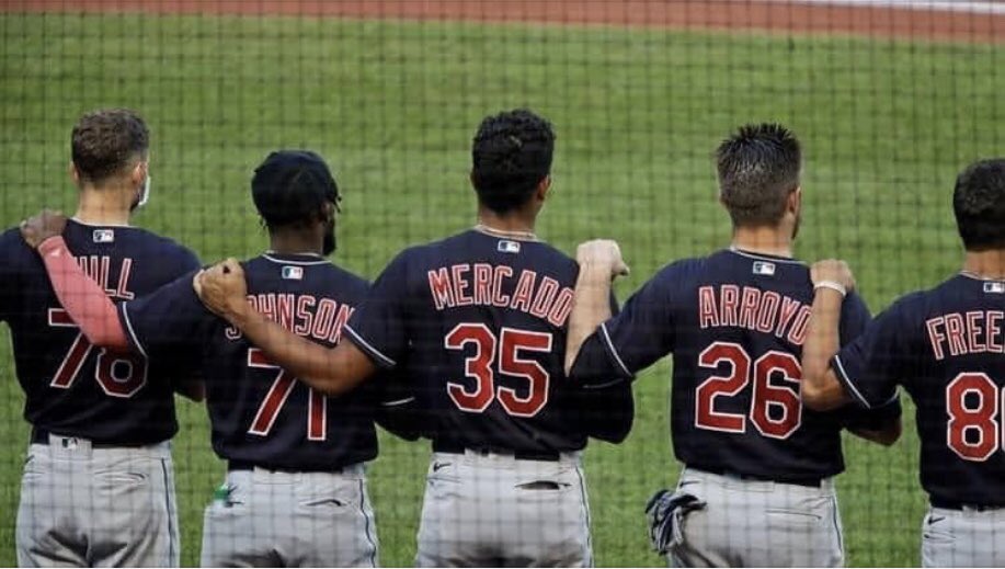 TDirkCline's tweet photo. The Cleveland Indians standing during the National Anthem with right hand over hearts and left hands on teammates.  Class!! https://t.co/doR67VkY9c