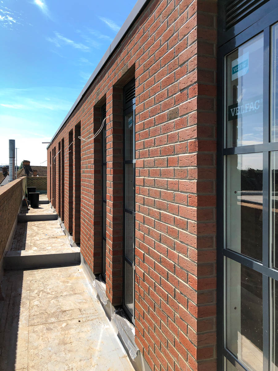 RenderlineLtd's tweet photo. *Project update*: We're almost done transforming this apartment block in Letchworth Garden City with beautiful brick-slips and render from @WetherbyEWI (photos include "before" picture, showing progress).
#brickslips #render #ewi #facades #constructionuk https://t.co/XttIROCXc6