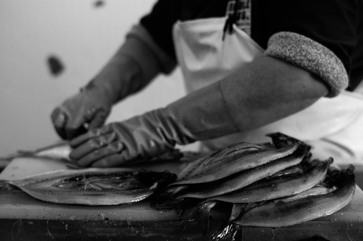 Filleting lines. #Scotland. From the series Gutted.
#galleryofthepeople @SirWilliamD #fishing #northeast #work #women #foodproduction #industry #blackandwhitephotography