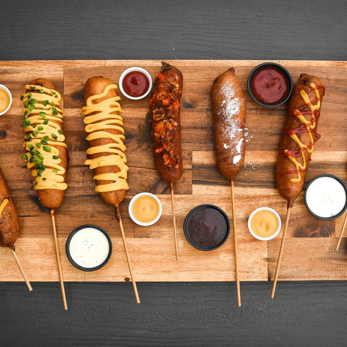CarnivalCafe1's tweet photo. Who let the dawgs out!? Woof woof!
Check out this Corn Dawg line up!
We got everything from kids corn dogs to the thud!
.
Tag a friend who loves corn dogs
👇
.
 #Carnivaleats #downtownchow #CalgaryEats #YYC  #yyceats #YYCnow #datenightyyc #EatCalgary #curiocitycalgary #foodporn https://t.co/gt6WJhpeY3