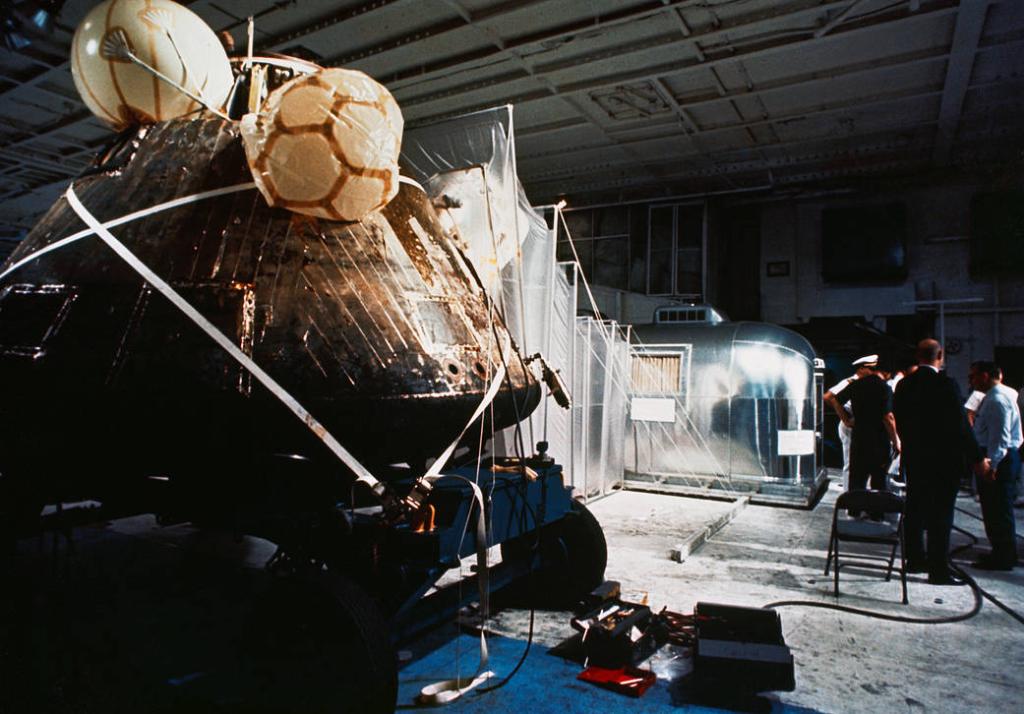 NASA's tweet photo. 51 years ago, #Apollo11 splashed down after the first human lunar landing and was recovered by the U.S.S. Hornet. Here we see the capsule and quarantine facility where the crew lived for 21 days to ensure they hadn't brought home any lunar germs: https://t.co/PrwoJwY0un https://t.co/sEl5cc9nix
