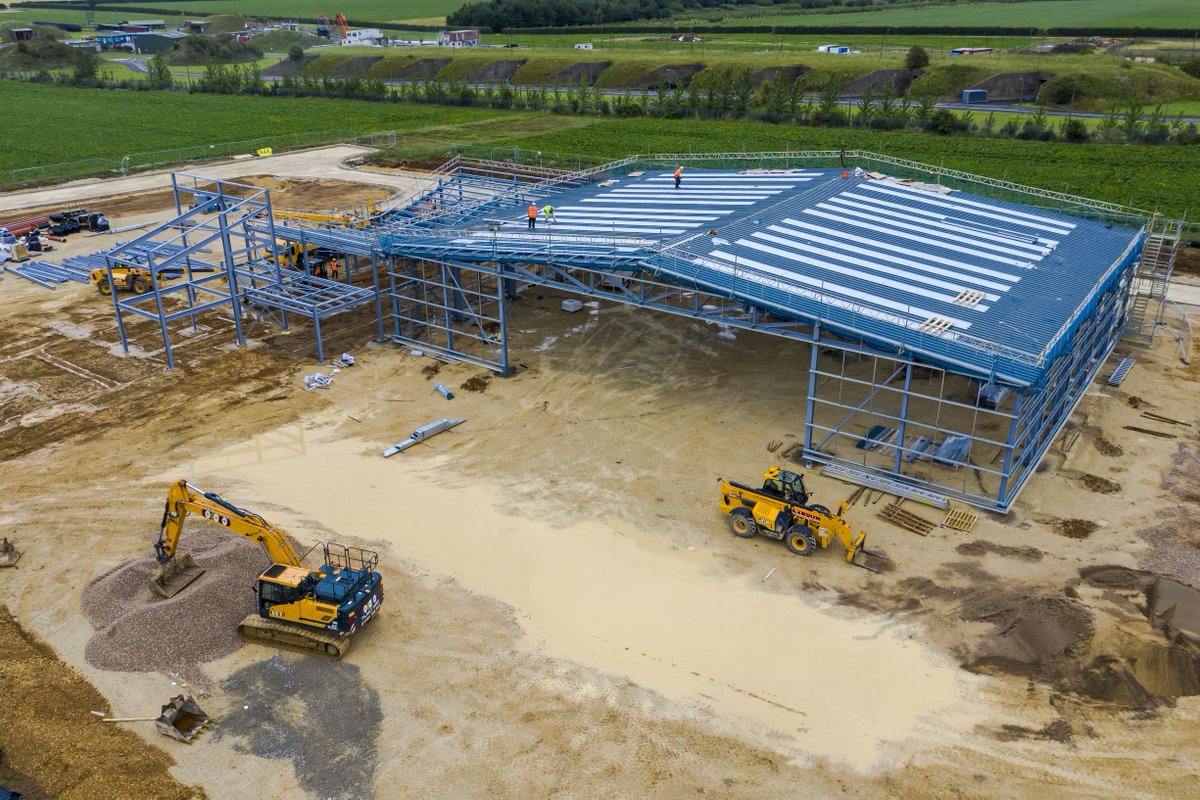 Construction at our new HQ is coming along nicely... The roof is on our hangar!  #newhome