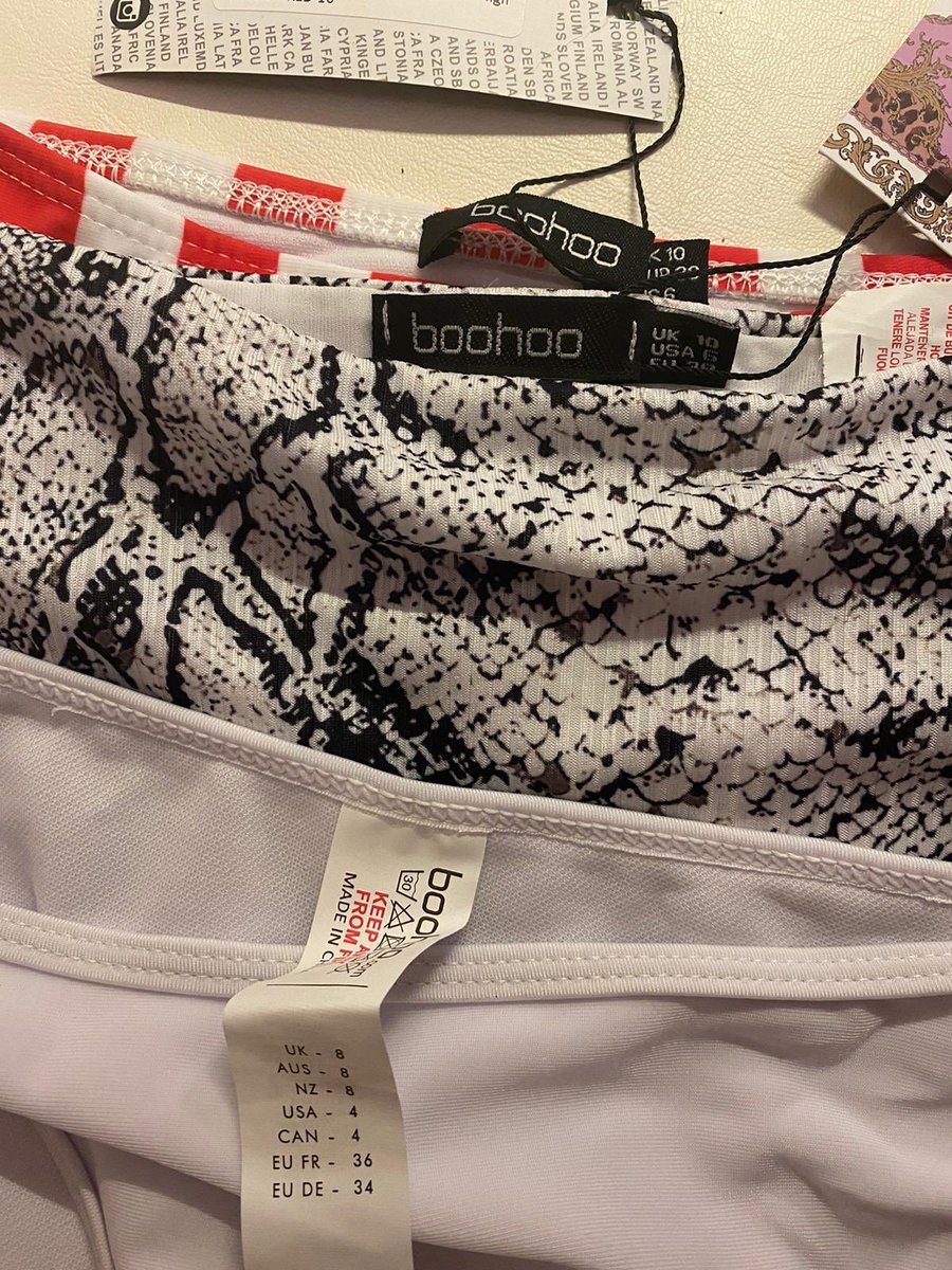 Ellzlittlewood's tweet photo. So my cousin ordered some last minute bits from @boohoo safe to say she is sending every item back. The top 2 bottoms are both a 10 yet ones smaller than the other. The white ones are an 8 and bigger than BOTH of the 10’s? How does that work? https://t.co/FOsCOTNzuJ