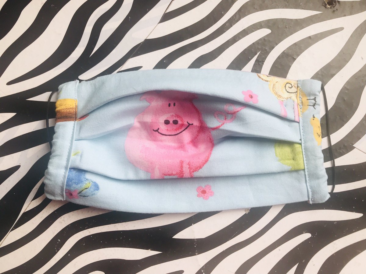 weeclothing's tweet photo. I always tell myself that scraps of fabric will come in handy someday. I say the say thing about the pieces of elastic attached to clothing tags. Today was the day when they both came in very handy. This little piggy can now go to the market with her new handmade mask #WearAMask https://t.co/GhsqeU4ztk