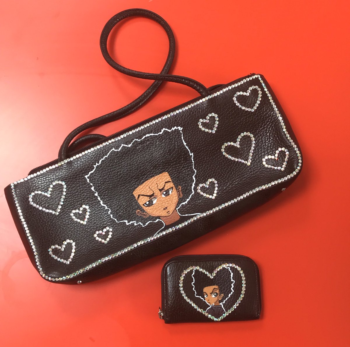 BlerdLinez's tweet photo. Matchy matchy bag and baby purse! All hand painted! #BlackOwned #buyblack #BLACKCREATORSFUND #blackcreatives #BlackPoundDay #blerd #hueyfreeman #boondocks #blackartist #blackanime https://t.co/0uOQy1nfDO