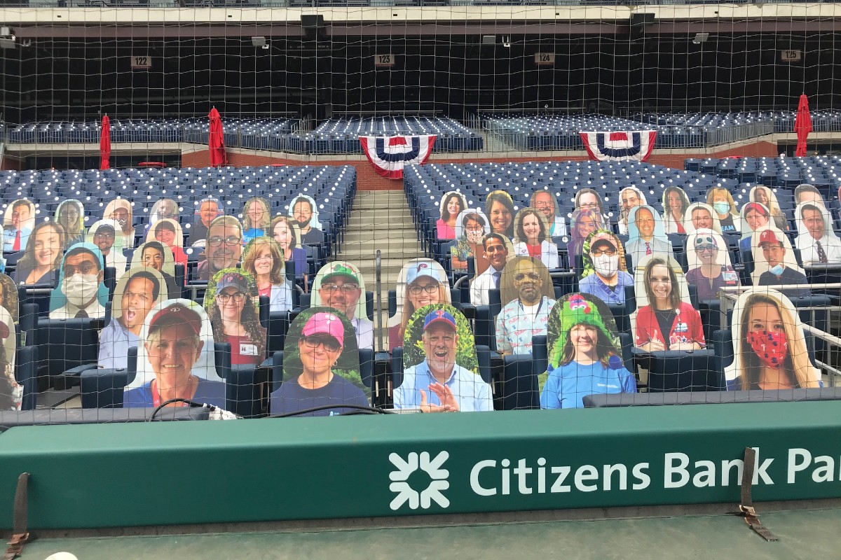 TJUHospital's tweet photo. Alex Chiem, a clinical nurse at Jefferson Methodist Hospital, had the honor of throwing out the first pitch of the 2020 @Phillies season, while more of our healthcare heroes are part of the Opening Day crowd, thanks to game faces in the stands. Play ball! ⚾ https://t.co/5v01KMzyqc