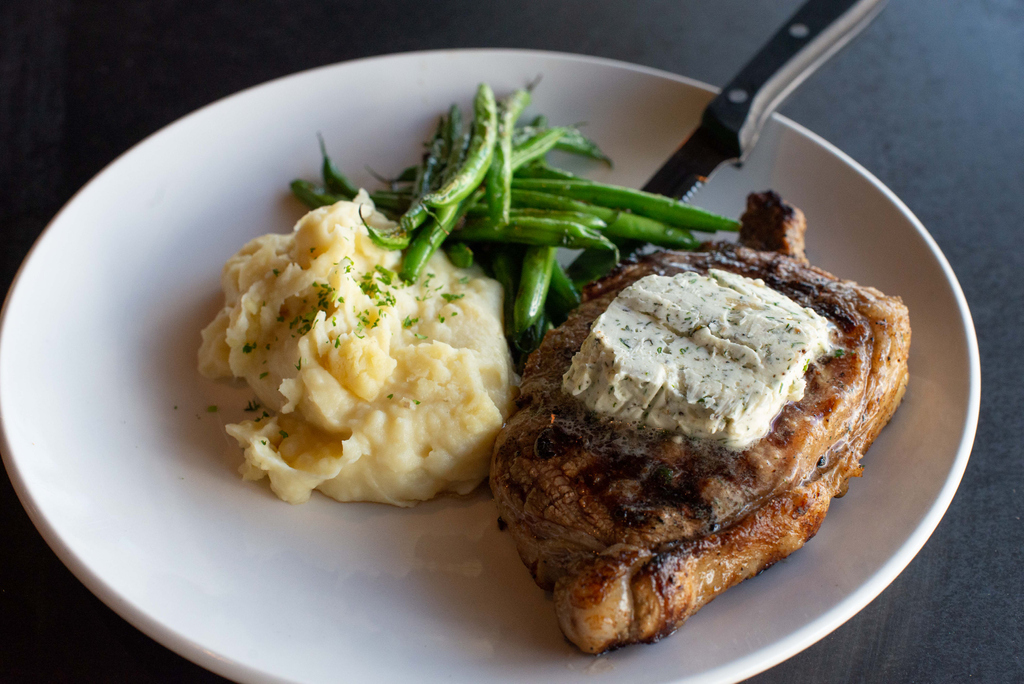 Oh hello there beautiful New York Strip topped with house made Boursin butter. Served with whipped Yukon gold potatoes and haricot verts.