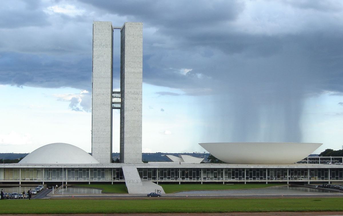 The National Congress Building in Brasilia, like all of that city is so different and fascinating that I find it hard to make a judgement. Love this photo that makes it look like rain falling into a bowl, though.