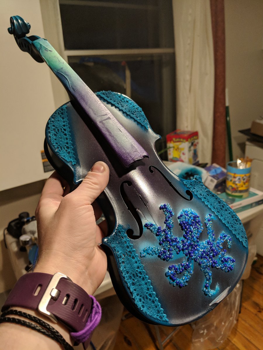 I was also very inspired by craftwork and traditional arts from Mexico, and this was my clumsy attempt at using beads for texture. You can still see the nice crack in the violin, see further tweets as it gets covered in epoxy and glitter.