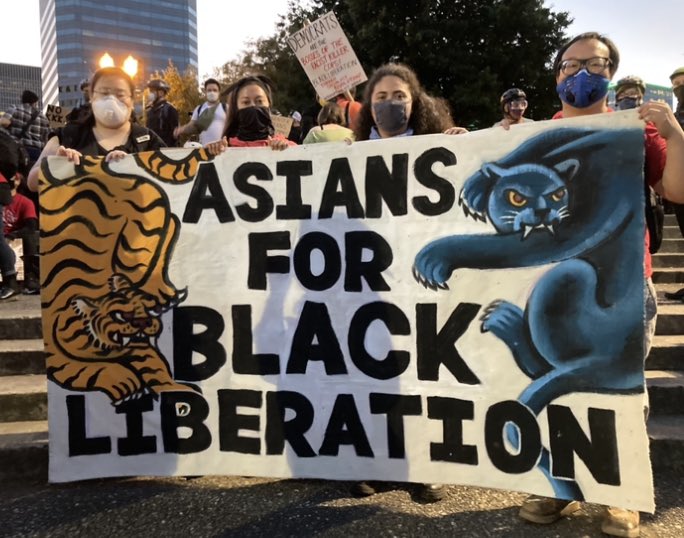 These protesters organized a self-identified Asian Bloc tonight. Getting ready to march to the Justice Center. They’re in red shirts!