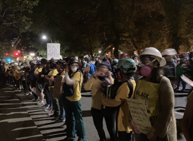 Asked a demonstrator in the wall of moms why they’d moved their backpacks to their front and the only one near me not wearing a gas mask said, “For protection.”