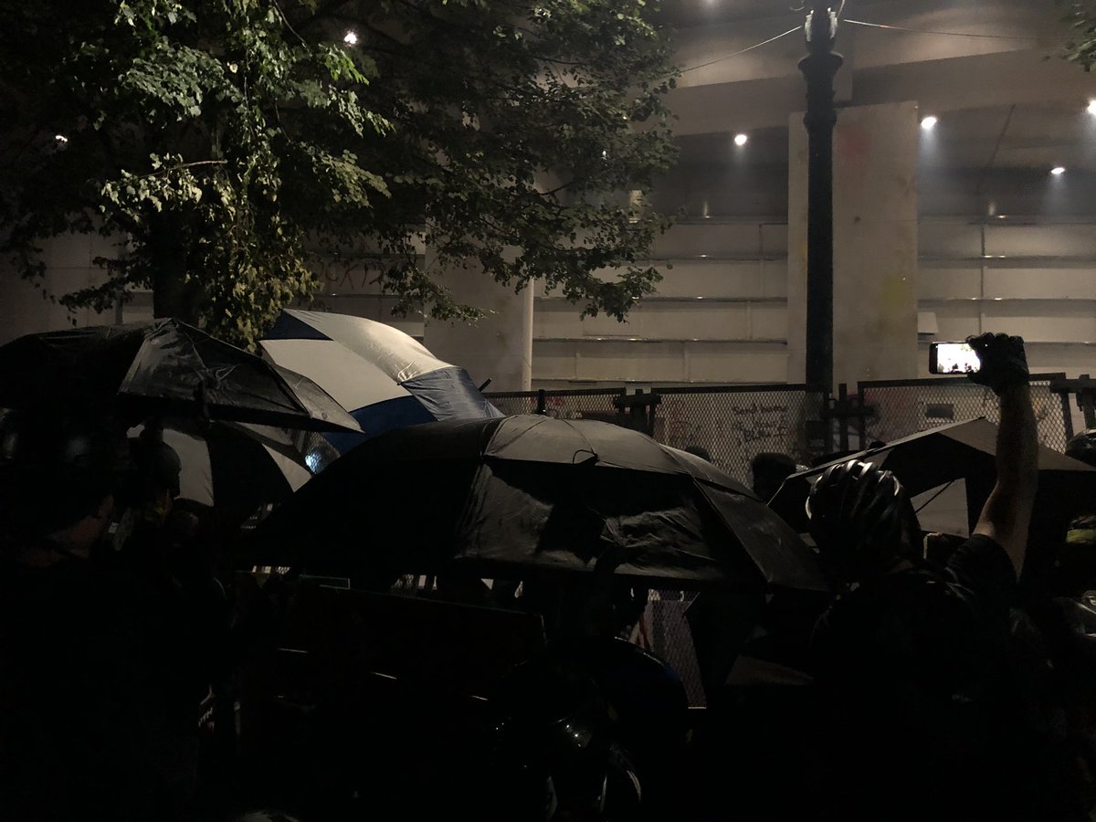 Umbrella fortress.  #PortlandProtest