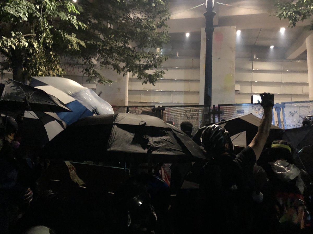 Umbrella fortress.  #PortlandProtest