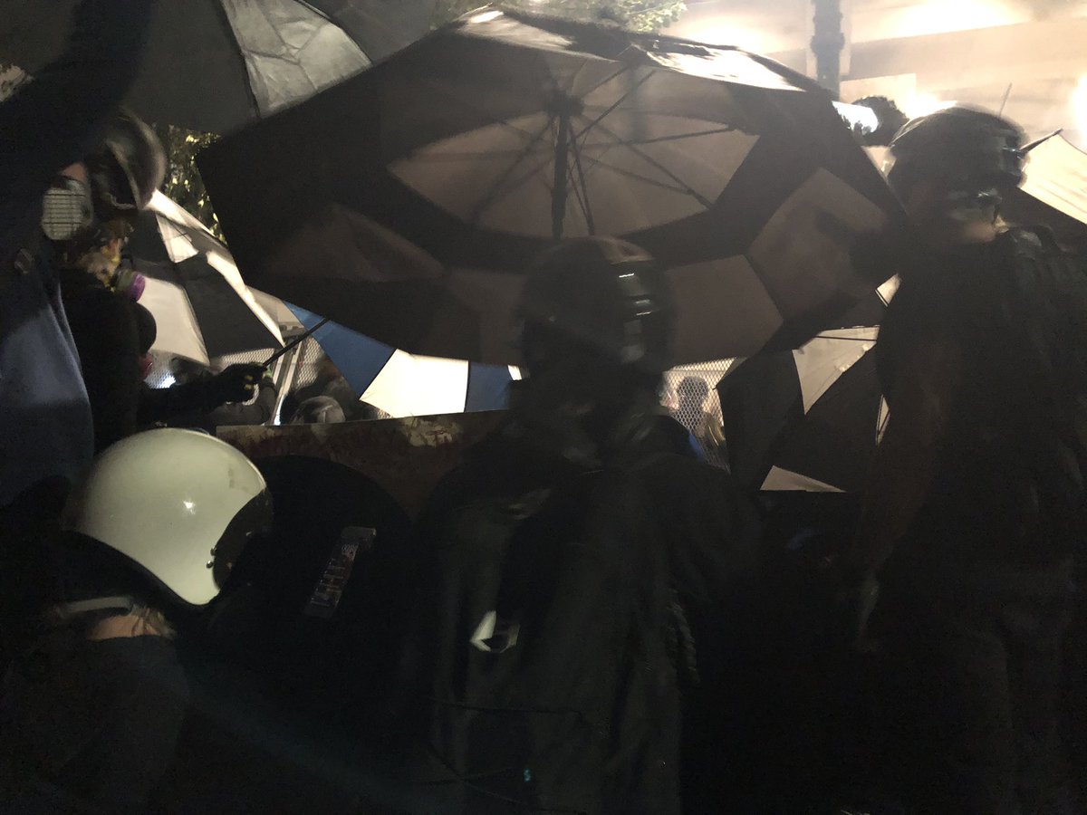 Umbrella fortress.  #PortlandProtest