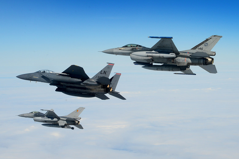 5472_nde's tweet photo. A #USAF F-15E Strike Eagle, #NetherlandsAF F-16 (top) and #BelgianAF F-16 (bottom) conduct aerial operations over the North Sea, July 17, 2020. (U.S. Air Force photo by Master Sgt. Matthew Plew) https://t.co/wu1dId2CBI