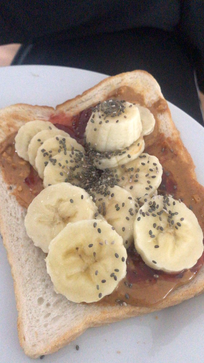 Existential_Doc's tweet photo. Organic 100% peanut butter, homemade jam, banana and chai seeds on a slice of Warburtons. #noketonestoday #goodgrub #workhardeathard https://t.co/zEilgHlw3K