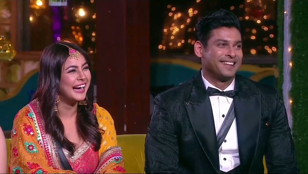 Everyone seated outside and both sana and Sid sat at the end close. Thoughout bb announcement both seemed little lost in their own thoughts..nervous laughs seemed louder and she was trying not to reach out take his hand. SK joined the house and trying lighten the mood for every1.