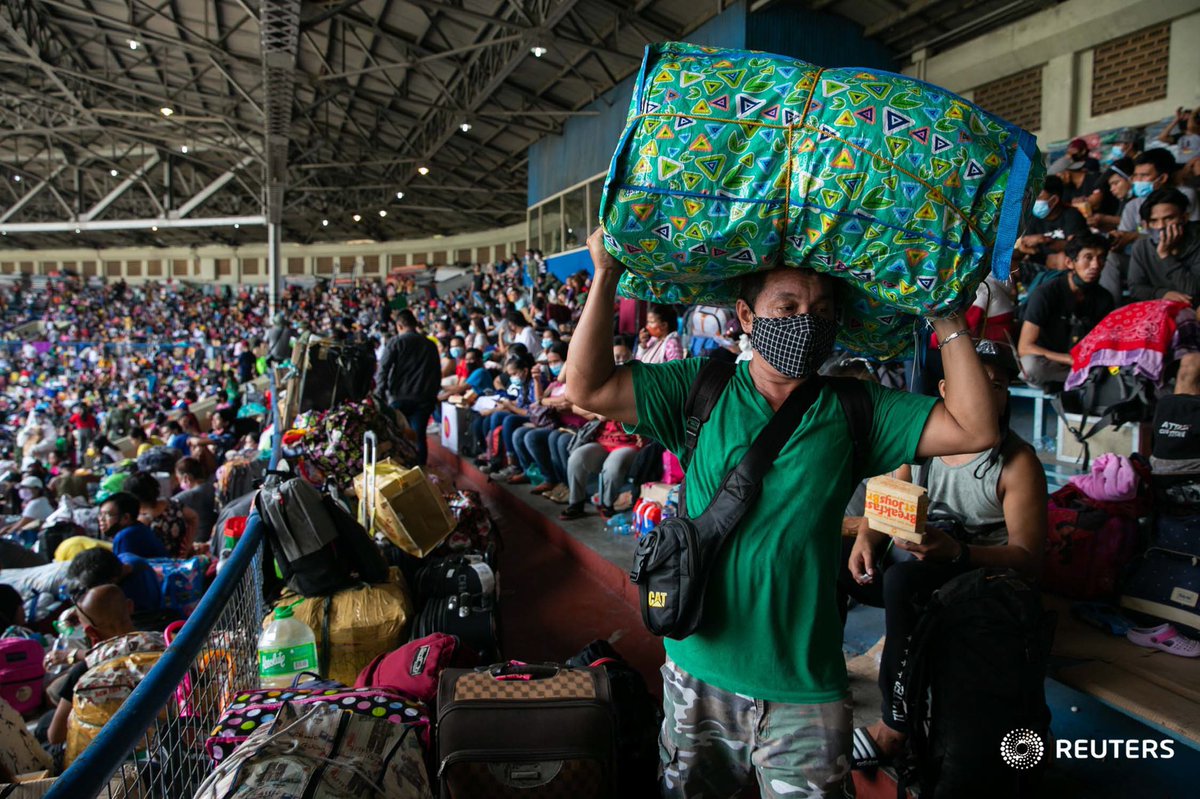 Scenes at Rizal Memorial Baseball Stadium this morning, where thousands of stranded Filipinos are crammed while waiting to be transported back to their provinces:  @reuterspictures