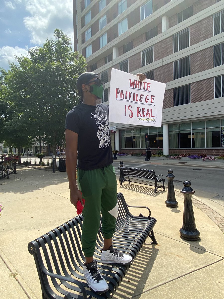 HaydeeFoxIL's tweet photo. A group gathers in downtown Champaign at the intersection of Main &amp; Neil Street to protest racism, evictions and social justice. https://t.co/ovsD5VpjPx