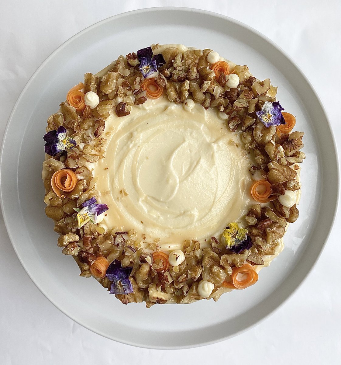 priyaoshea's tweet photo. Really fancied a carrot cake (rest of the family don’t like carrot cake 🤷🏽‍♀️) 
I weighed the ingredients out days ago but was too far behind on my writing schedule to bake and ice it. Well finally did, and it was rather nice. 
I’m now writing again (still behind) but with cake. 👍🏽 https://t.co/VPESF1yMlq