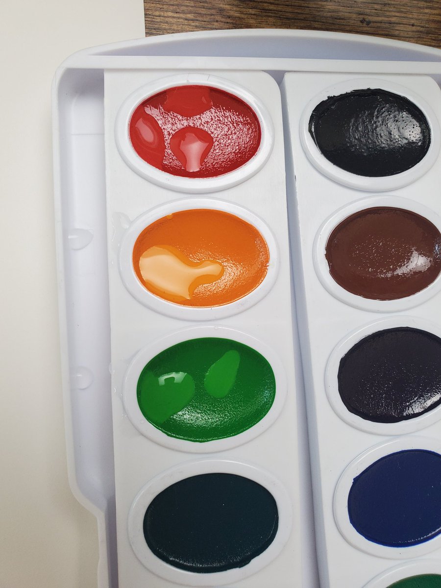 When you get started, the first thing you want to do is add a drop of water to every pan. This is going to activate the pigments. I like to make a switch reference sheet and also test out color mixtures on a small test sheet.