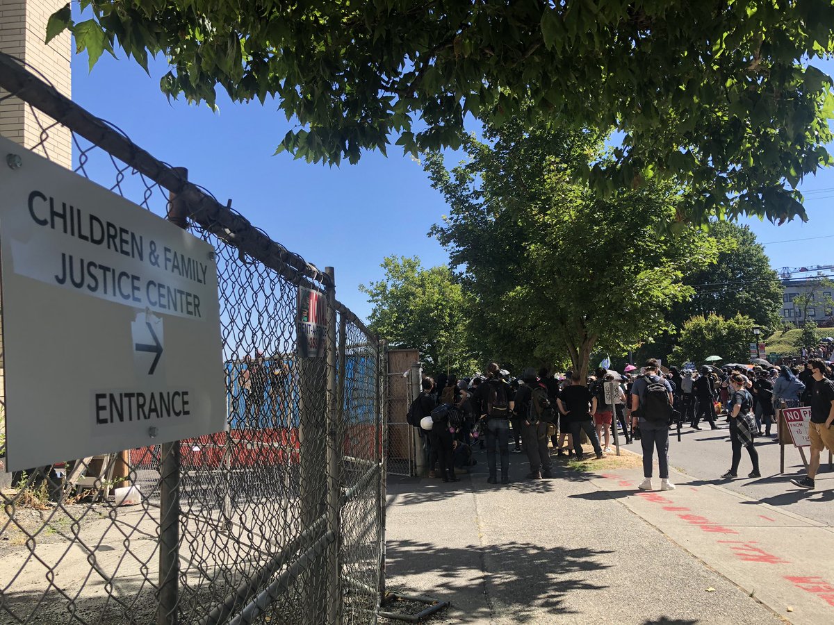 Protesters are gathering around he juvenile detention center / youth jail Background from  @davidlgutman  https://www.seattletimes.com/seattle-news/in-state-of-county-speech-constantine-pledges-to-close-king-county-adult-and-youth-jails-renew-childrens-levy/