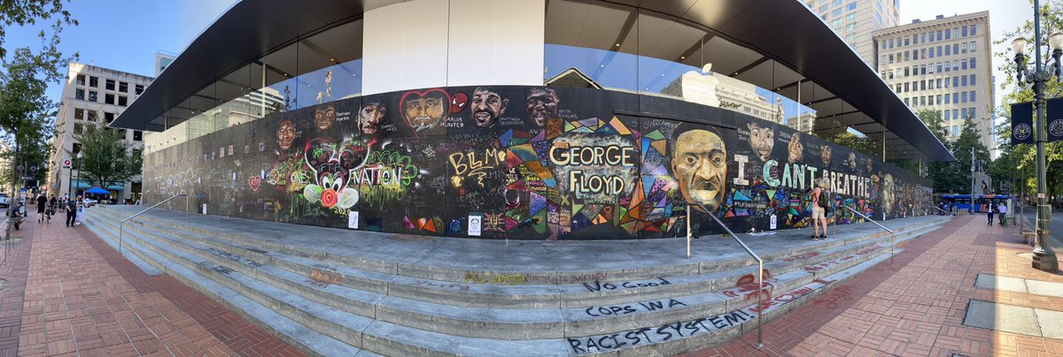 The wall outside the Apple Store is amazing, sad, and beautiful all at once.