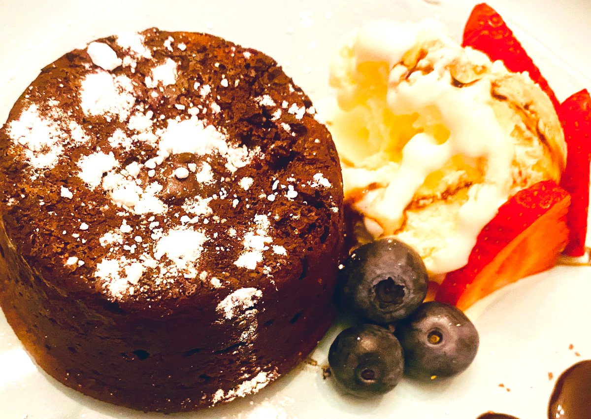Love making lava cake for dessert! The most simple from scratch treat, made within minutes. Added: a side of vanilla ice-cream drizzled with caramel topping and fresh fruit. A sprinkle of powdered sugar on top of the #lavacake tops it off. #bakingforfriends