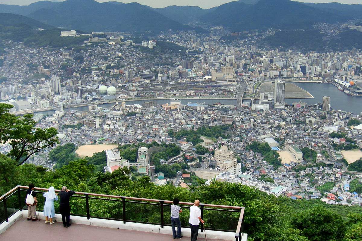 12/61Gathered in the assembly hall, the students at Inasa Elementary bowed to the emperor's portrait and awaited as the principal began his address. The school was not far from where Dō-oh lived on Mount Inasa, just outside Nagasaki. Her father worked at Mitsubishi in the city.