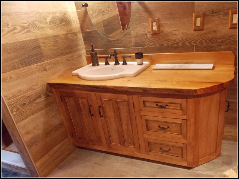 Live edge vanity cherry top with stained basswood cabinet. #customcabinet #livingedge #cherry #basswood