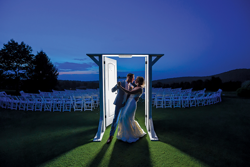 "We were married underneath the arbor with a beautiful sky above us. Kyle’s father created beautiful custom doors for us to walk through when entering the ceremony and my brother officiated, two very special aspects for us." - Kathleen &amp; Kyle
manhattanbride.com/real-weddings/…