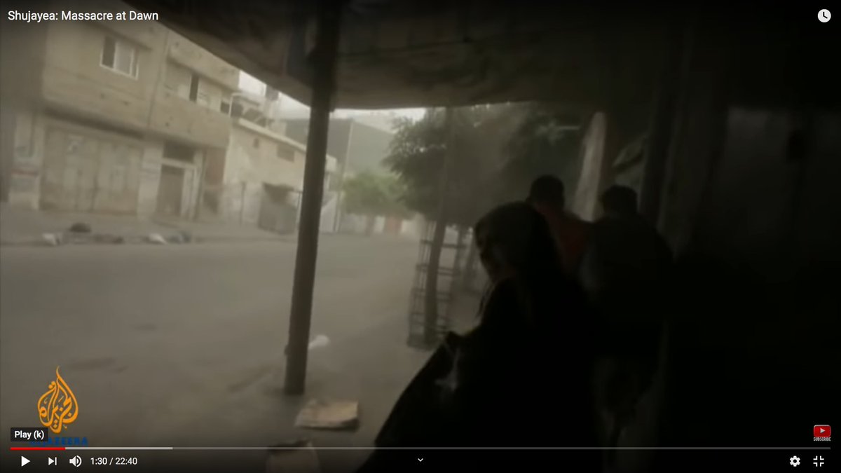 Look at the area above the woman's head.You can see dust pouring down from the mortar detonation.You can also hear debris hitting the metal awnings.