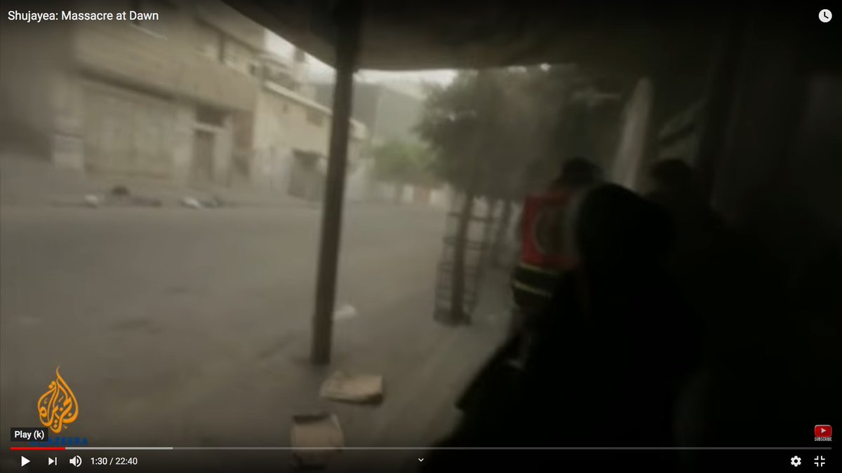 Look at the area above the woman's head.You can see dust pouring down from the mortar detonation.You can also hear debris hitting the metal awnings.