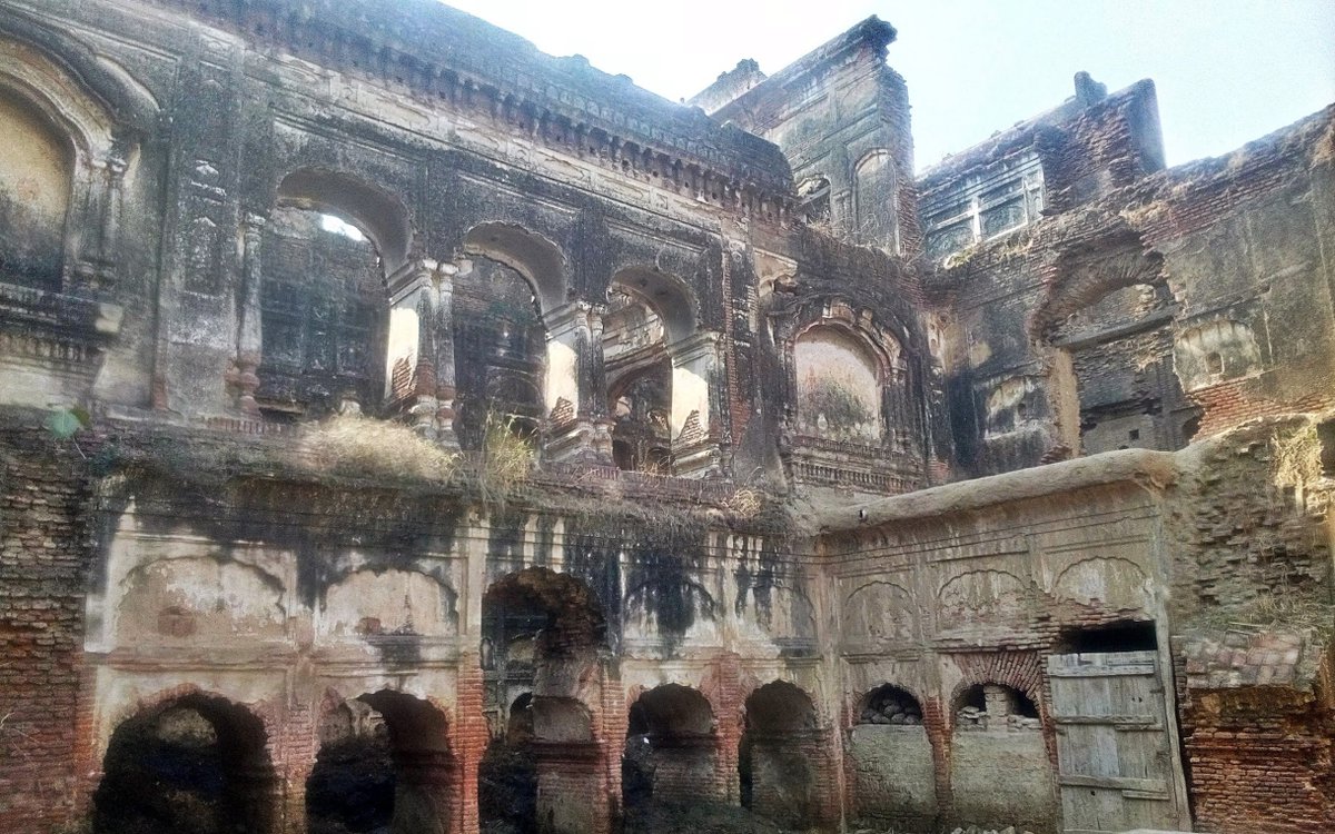 Main building is in red burnt brick with the signature plaster of gach from olden daysTime and neglect have faded the shades of true yellow to a stale greyThere must have been floral frescoes and intricate ornamental work of which very scanty remains survive at few odd places
