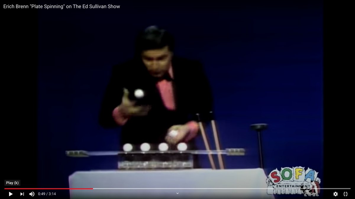 He set up a bunch of raw eggs on a tray over empty glasses, and he knocked the tray out from under them with two pool cues on a cue rack or bridge.The eggs fell in the glass just before the bowls and plates stopped spinning.Before the eggs fell (left) and after (right).