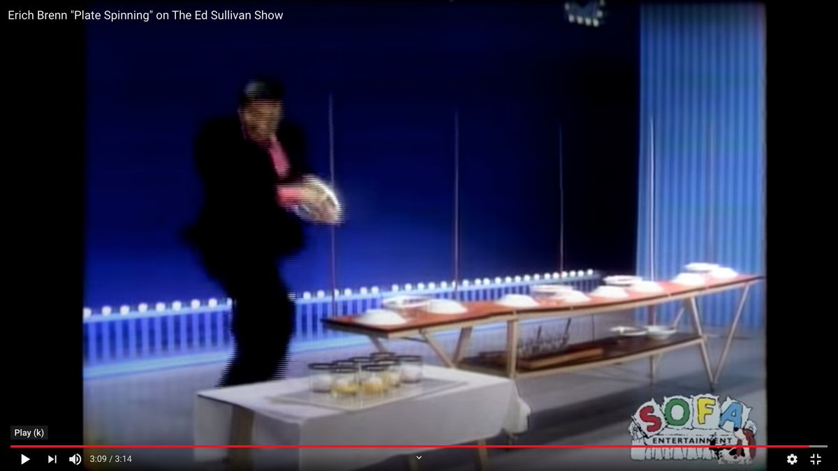 He set up a bunch of raw eggs on a tray over empty glasses, and he knocked the tray out from under them with two pool cues on a cue rack or bridge.The eggs fell in the glass just before the bowls and plates stopped spinning.Before the eggs fell (left) and after (right).