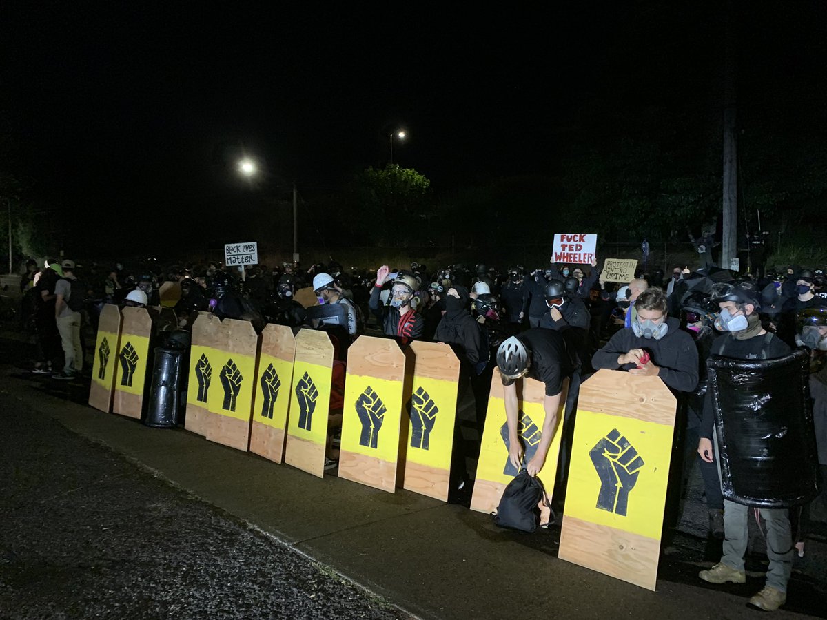 As it took forever for that video to load, we are at the Penumbra Kelly building and police bullrushed a few photographers standing on the grass on the other side of this yellow shield line.
