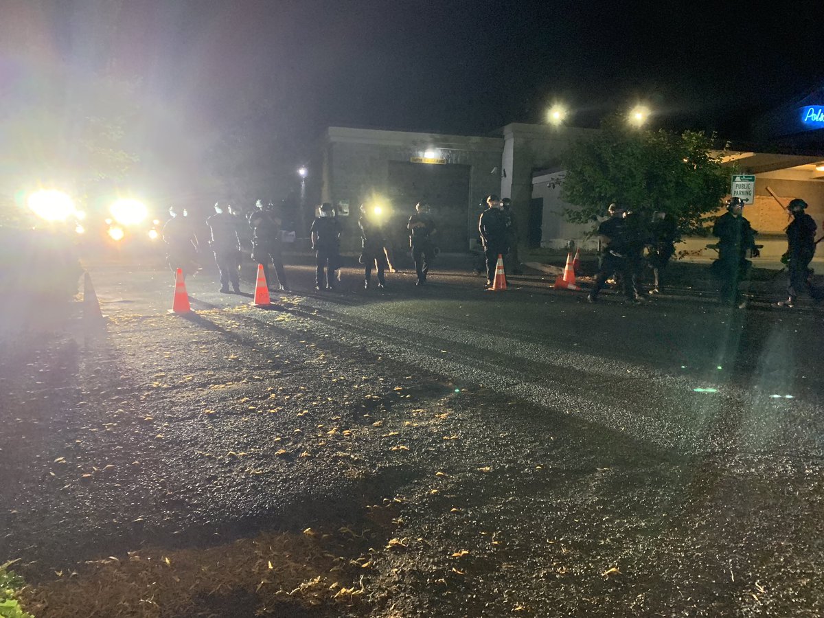 As it took forever for that video to load, we are at the Penumbra Kelly building and police bullrushed a few photographers standing on the grass on the other side of this yellow shield line.