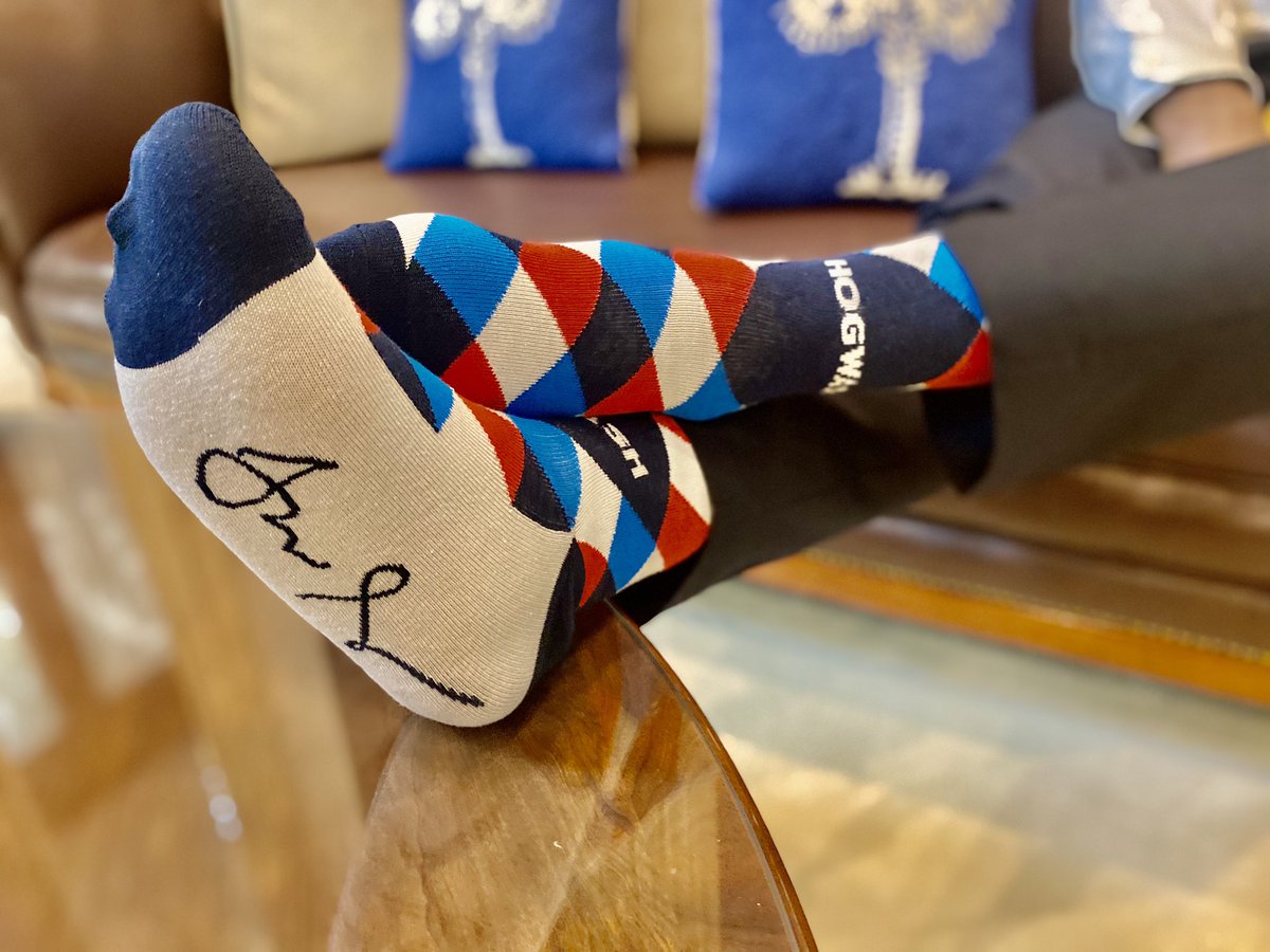 SenatorTimScott's tweet photo. I was so happy to bring some Carolinian common sense to my colleagues this week. Just a reminder to walk the talk with these “Scott Says Socks.” #Hogwash #BlessYourHeart #ScottSays #SockittoMe #SCRocks https://t.co/ffnG6Jsfvr