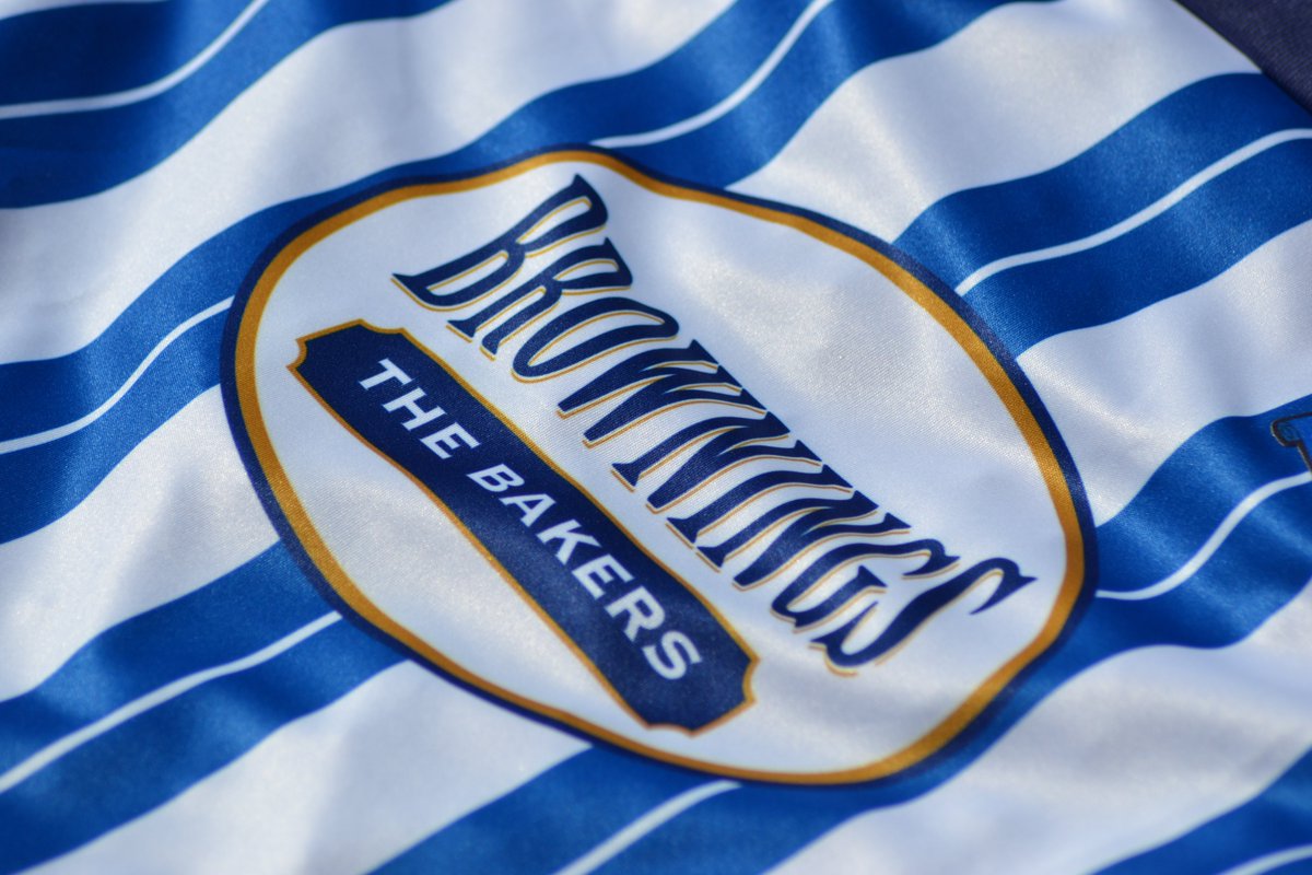 The  @BrowningsBakers logo is sublimated/printed on to the home shirt, but it is a heat transfer on the away. Adding a transfer to a striped shirt is tricky to centre every time. The stripes are sublimated, might as well sublimate the sponsor. Good for quality control.