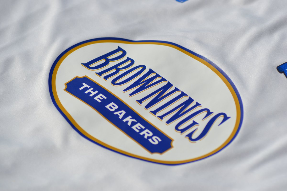 The  @BrowningsBakers logo is sublimated/printed on to the home shirt, but it is a heat transfer on the away. Adding a transfer to a striped shirt is tricky to centre every time. The stripes are sublimated, might as well sublimate the sponsor. Good for quality control.