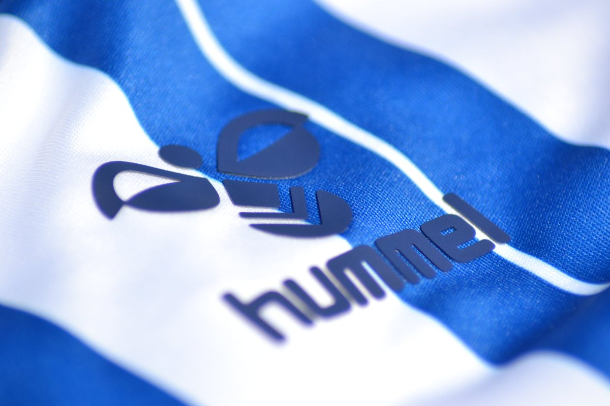 The Hummel ogos on both shirts are an raised applied rubber. I think people have an aversion to this sort of 3D application because of the old 90s Matchwinner shirts. Those badges and sponsors back then were only "glued" around the edges.