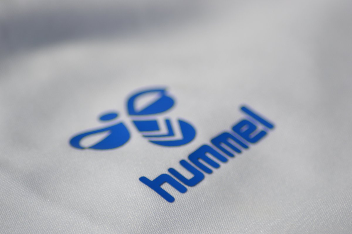 The Hummel ogos on both shirts are an raised applied rubber. I think people have an aversion to this sort of 3D application because of the old 90s Matchwinner shirts. Those badges and sponsors back then were only "glued" around the edges.