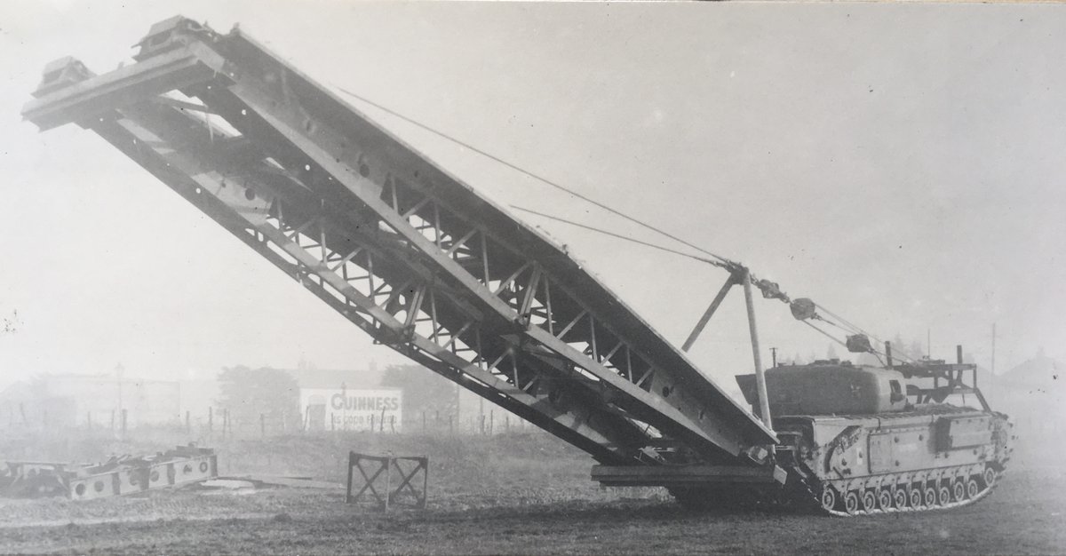 The Small Box Girder (SBG) assault bridge was one of the devices carried by the AVREs of 79th Armoured Division in NW Europe. The bridge was developed in 1943 (see photo). It was 34 feet 6 inches long, could be used on a 30 foot gap and had a 40 ton capacity. 1/14